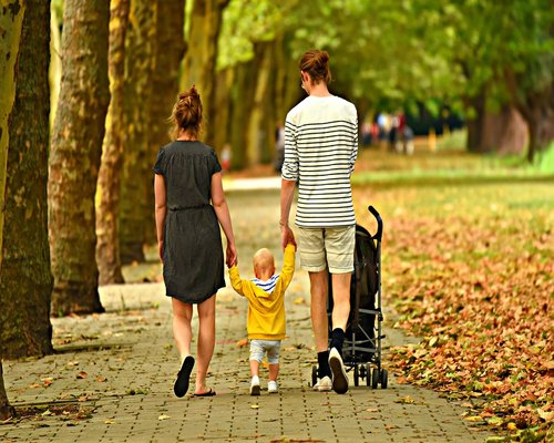 Multigenerational family walking in a park